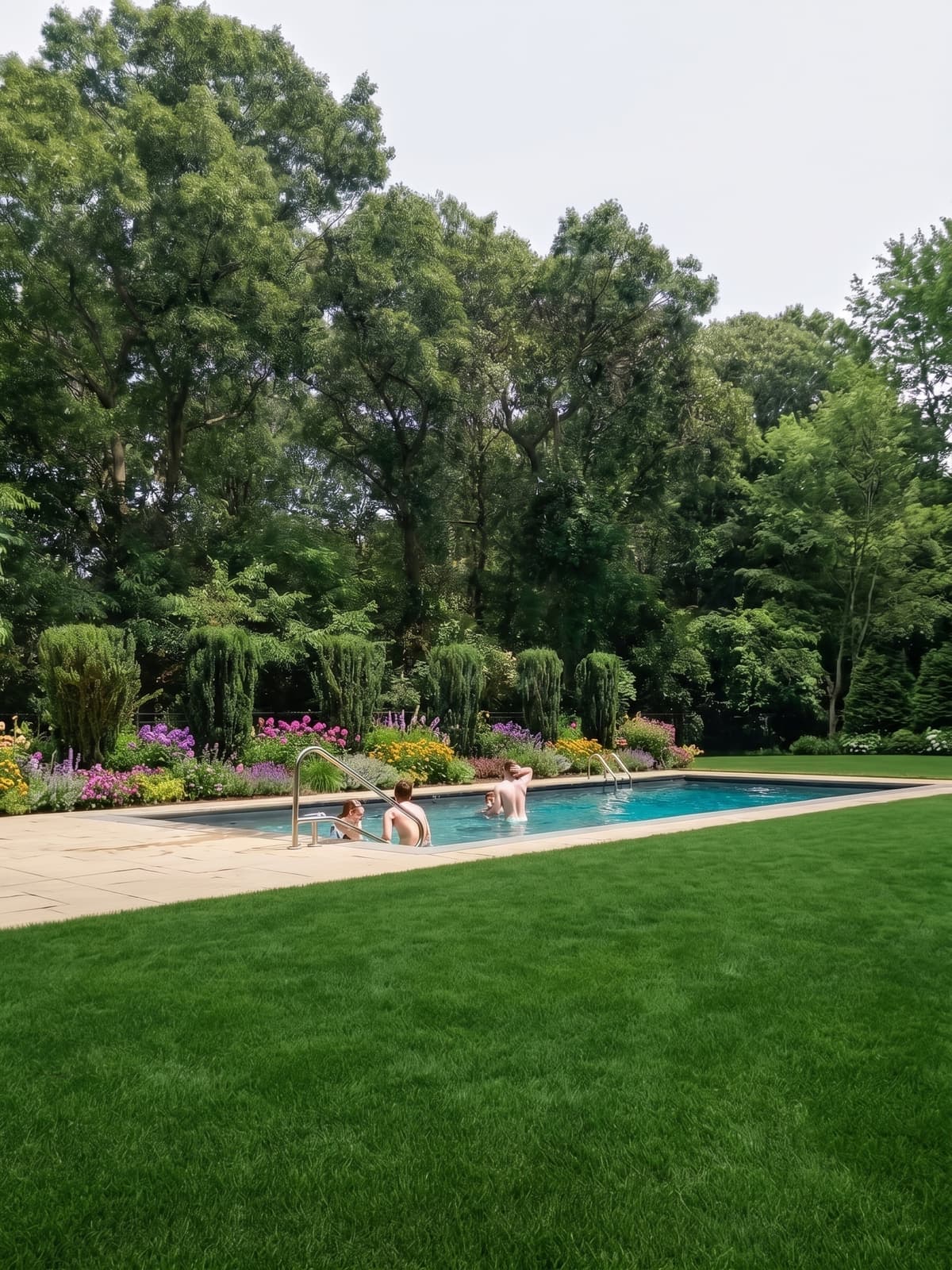 Renovated lap pool set into a landscaped garden
