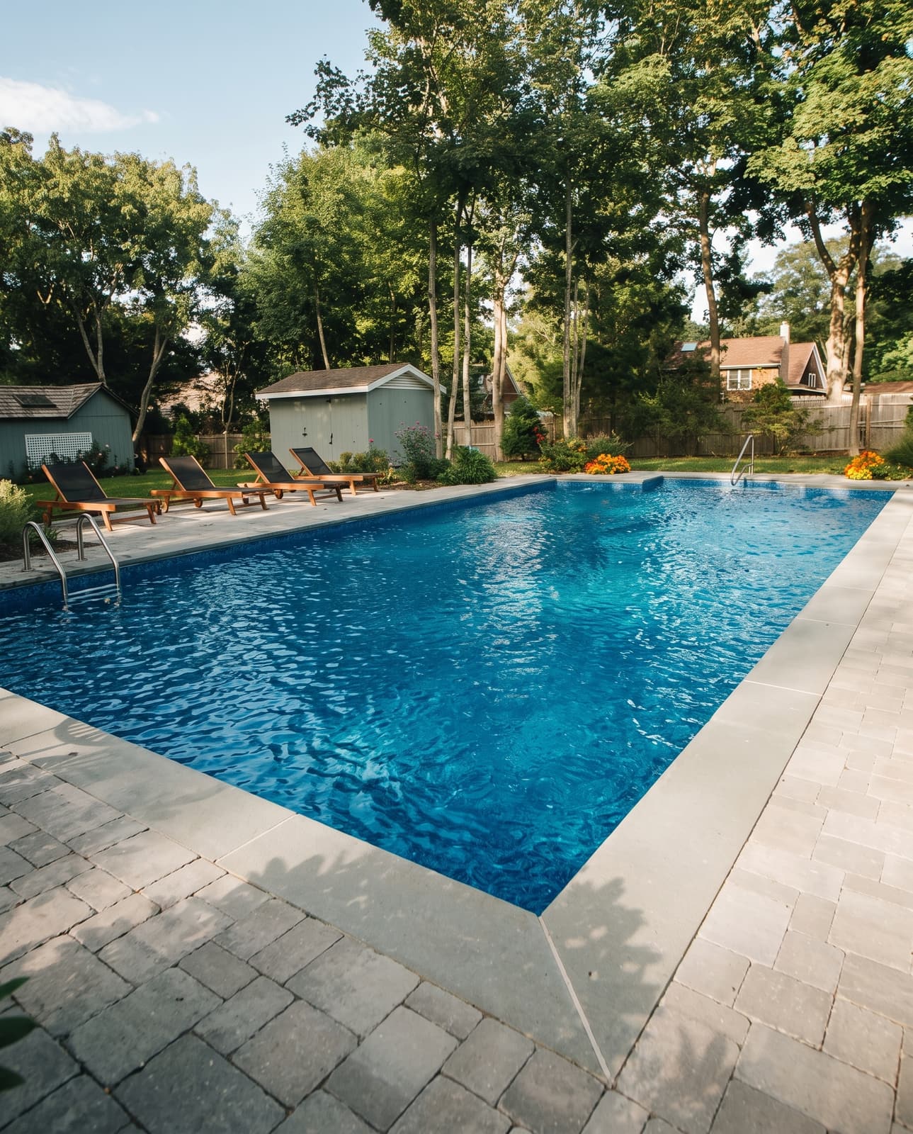Fresh vinyl liner replacement with a crisp blue pattern and clean waterline tile