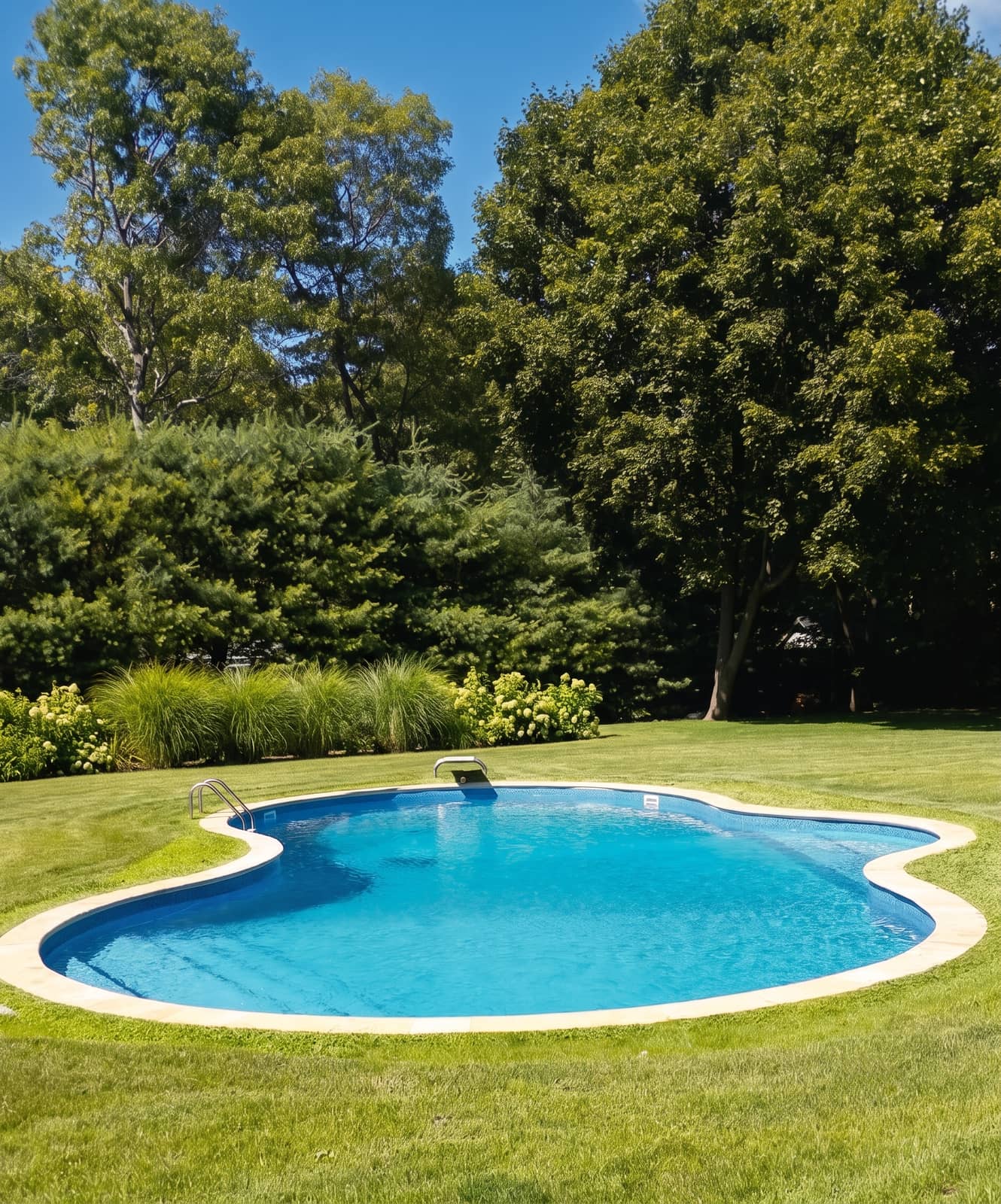 Freeform kidney-shaped vinyl pool with a new liner and surrounding patio